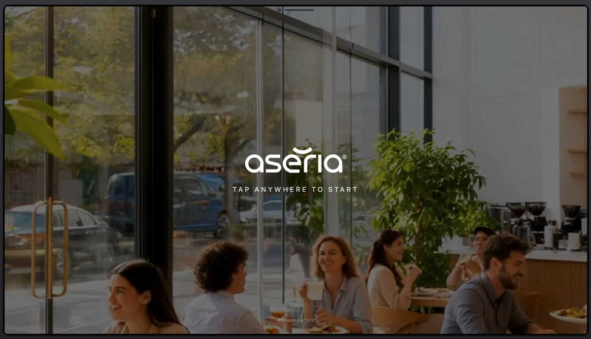Aseria POS attract screen with the brand mark and a tap-anywhere-to-start prompt over ambient footage