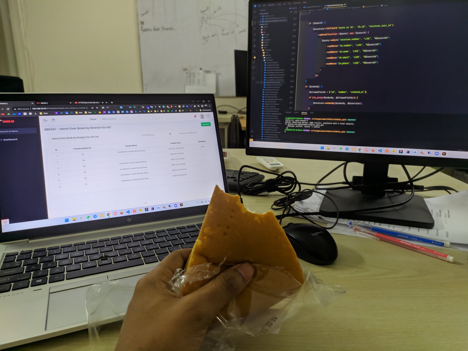 A plate of samosas next to a laptop showing a terminal.